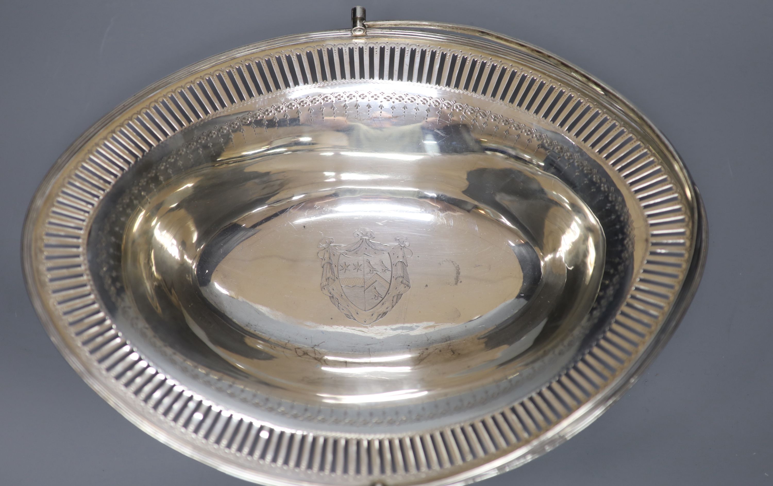 A George III pierced silver oval cake basket, maker's mark rubbed, London, 1786